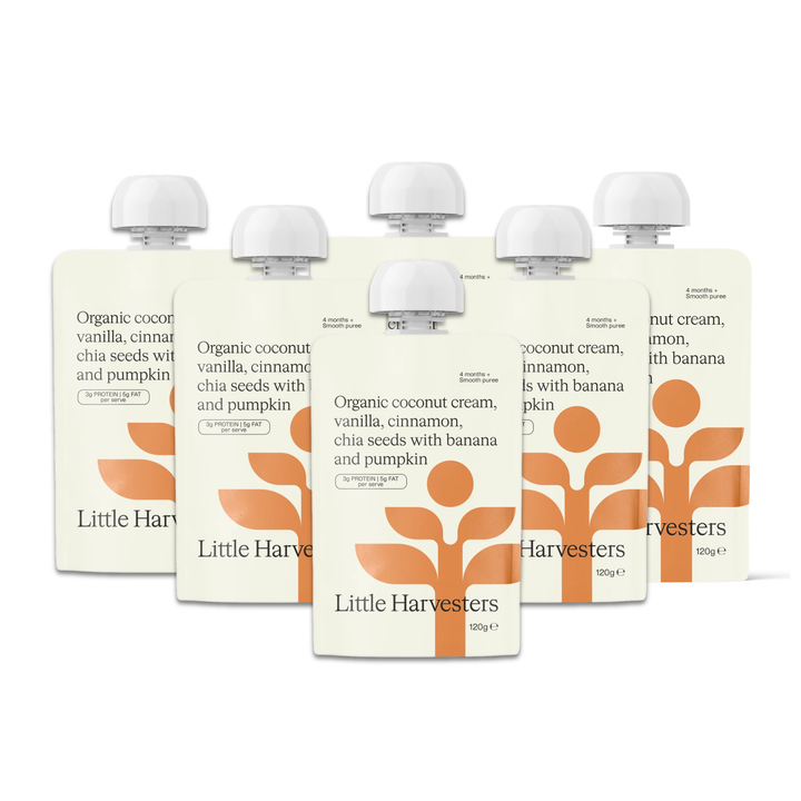 Six Little Harvester coconut cream pouches arranged in a fan shape on a white background. The front pouch is fully visible, showing the brand name 'Little Harvester' and a prominent orange stylized leaf logo.